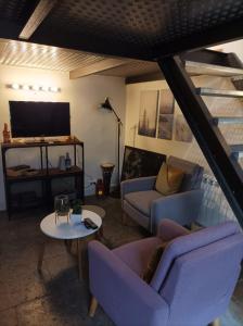 TV a/nebo společenská místnost v ubytování Appartement centre ville NIMES