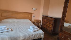Postelja oz. postelje v sobi nastanitve Albergo Minetto