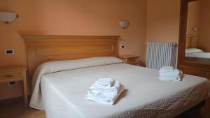 Postelja oz. postelje v sobi nastanitve Albergo Minetto