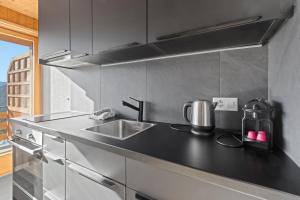 A cozinha ou cozinha compacta de Superbe studio avec une vue magnifique