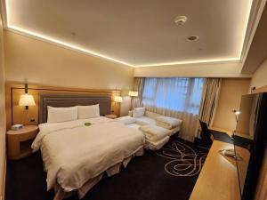 Voodi või voodid majutusasutuse K Hotel Taipei Songjiang toas