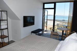 Postel nebo postele na pokoji v ubytování Hotel Kerteminde Strand