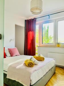 a bedroom with two beds and a window at Saltwater Apartment Gdynia in Gdynia