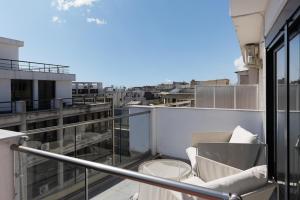 a balcony with a view of a city at Ophelia Apartments by halu!, Luxury Apt with Hot Tub in Thessaloniki