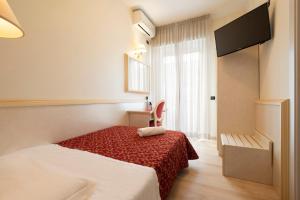 Кровать или кровати в номере Hotel Mondial