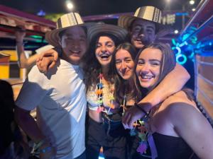 a group of people posing for a picture at a party at Mao's Party Experiment in Bogotá