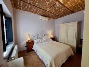 Posteľ alebo postele v izbe v ubytovaní Le Serre Suites & Apartments