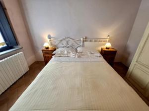 Posteľ alebo postele v izbe v ubytovaní Le Serre Suites & Apartments