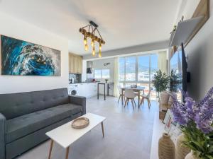 a living room with a couch and a table at Hanami Avenida de España Mountain View 5H in Estepona