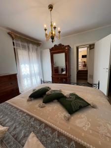 a bedroom with a bed with two pillows on it at Casa Vacanze Il Borgo in Gubbio