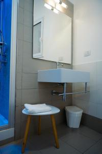 a bathroom with a sink and a toilet at Finestra sui Ponti in Ragusa