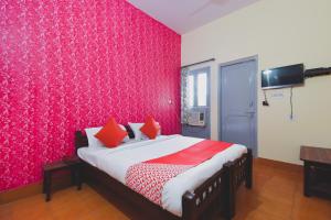 Ένα ή περισσότερα κρεβάτια σε δωμάτιο στο Hotel O Aditya