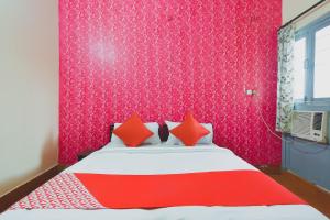Ένα ή περισσότερα κρεβάτια σε δωμάτιο στο Hotel O Aditya