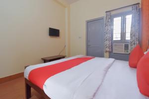 Ένα ή περισσότερα κρεβάτια σε δωμάτιο στο Hotel O Aditya