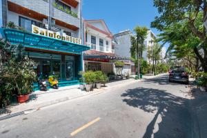 a city street with a store on the side of the road at Saluton House in Da Nang