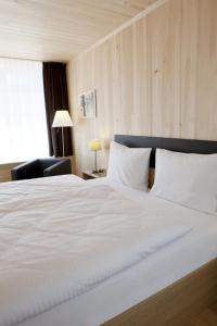 Postel nebo postele na pokoji v ubytování Hotel am Garnmarkt