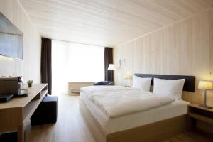 Voodi või voodid majutusasutuse Hotel am Garnmarkt toas