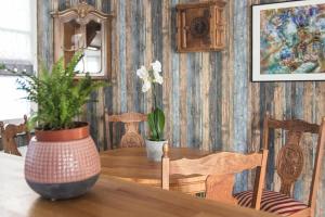 a dining room table with two potted plants on it at 3-Zimmer Wohnung mit Terasse im Herzen Bambergs in Bamberg +1 photo