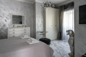 Ένα ή περισσότερα κρεβάτια σε δωμάτιο στο Golden Garden