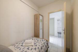 Postel nebo postele na pokoji v ubytování Downtown City Apartment + 37 fotografií
