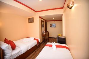 Voodi või voodid majutusasutuse Tibet Boutique Hotel toas