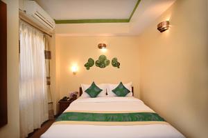 Voodi või voodid majutusasutuse Tibet Boutique Hotel toas