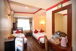 Voodi või voodid majutusasutuse Tibet Boutique Hotel toas