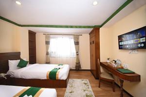 Voodi või voodid majutusasutuse Tibet Boutique Hotel toas
