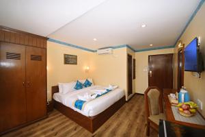 Voodi või voodid majutusasutuse Tibet Boutique Hotel toas