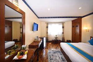 Voodi või voodid majutusasutuse Tibet Boutique Hotel toas