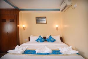 Voodi või voodid majutusasutuse Tibet Boutique Hotel toas