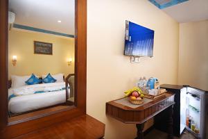 Voodi või voodid majutusasutuse Tibet Boutique Hotel toas