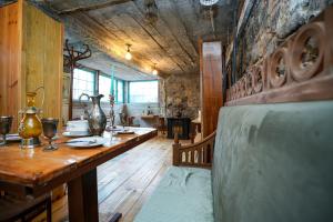 a large room with a wooden table and a table sidx sidx sidx at The Victorian Hotel & Spa Room 3 in Yerevan