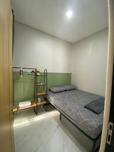 Postel nebo postele na pokoji v ubytování Gebe House - Guest House & Homestay Jogja