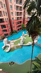 a resort with a water park in front of a building at seven sea F508 in Jomtien Beach