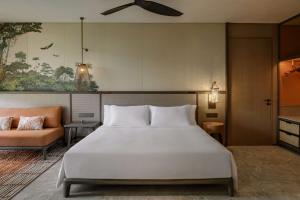 Voodi või voodid majutusasutuse Mandai Rainforest Resort by Banyan Tree toas