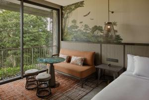 Voodi või voodid majutusasutuse Mandai Rainforest Resort by Banyan Tree toas