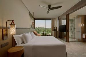Voodi või voodid majutusasutuse Mandai Rainforest Resort by Banyan Tree toas