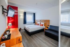 Postel nebo postele na pokoji v ubytování Hotel Corsendonk Viane