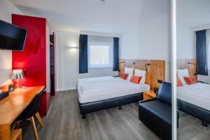 Postel nebo postele na pokoji v ubytování Hotel Corsendonk Viane