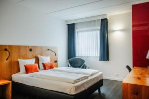 Postel nebo postele na pokoji v ubytování Hotel Corsendonk Viane