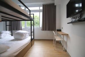 Postel nebo postele na pokoji v ubytování Taipei Sunny Hostel