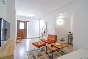 a living room with a couch and a table at Casa Alegre by Casasol in Nerja