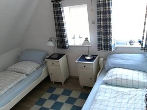 Katil atau katil-katil dalam bilik di Ferienhaus Iljo am Deich