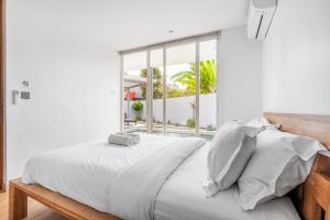 Postel nebo postele na pokoji v ubytování LYB Villa Bali + 11 fotografií
