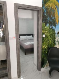 Postel nebo postele na pokoji v ubytování Ermioni Apartments