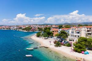a view of a beach with boats in the water at Family friendly house with a swimming pool Brodarica, Sibenik - 24117 in Šibenik