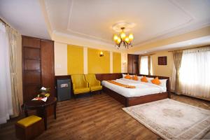 Voodi või voodid majutusasutuse Tibet Boutique Hotel toas