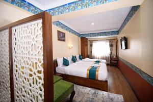Voodi või voodid majutusasutuse Tibet Boutique Hotel toas