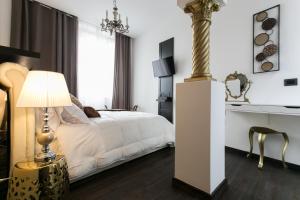 Postel nebo postele na pokoji v ubytování Aparthotel Dei Mercanti